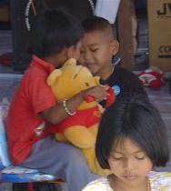 Children at one of the camps receive comfort through reliable traditional characters